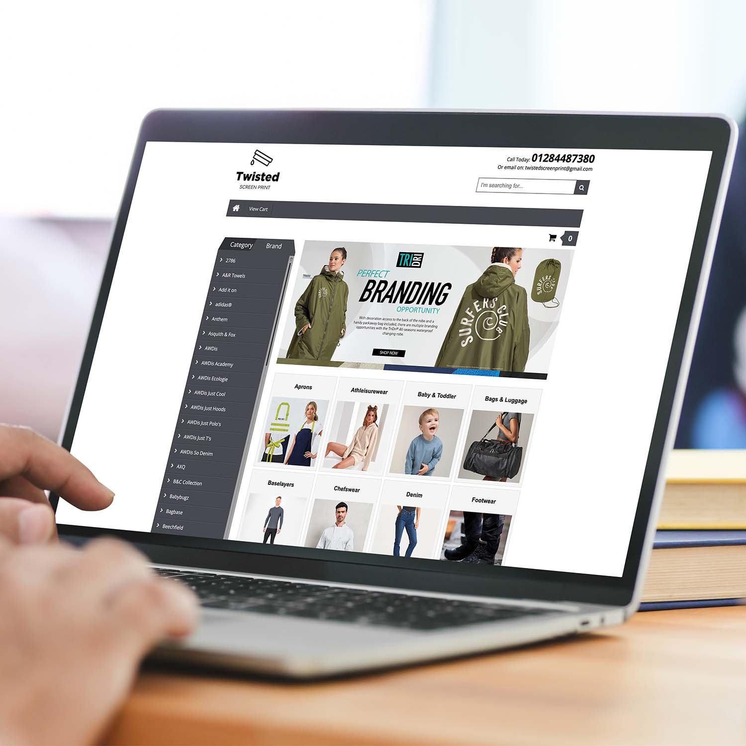 person-browsing-garment-catalogue-website-on-laptop-square Person browsing garment catalogue website on laptop